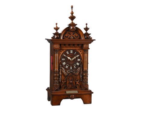 A GERMAN BLACK FOREST CARVED WALNUT 'TRUMPETER' MANTEL CLOCKGORDIAN HETTICH SOHN, FURTWANGEN, LATE 19th CENTURYThe twin going