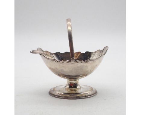 A George V silver swing handled basket, of navette form, with a shaped rim, on a stepped oval base, by Atkins Brothers Ltd, S