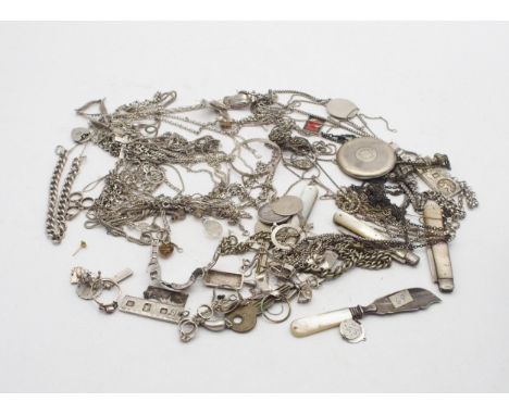 A collection of silver and white metal items including chains,&nbsp; loose charms, silver St. Christopher pendants and chains