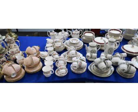 A Royal Doulton Celtic Jewel tea and coffee service comprising tea and coffee pots, cups and saucers, plates etc together wit