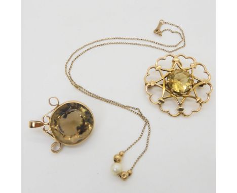 A 9ct gold citrine brooch, a yellow metal smoky quartz pendant, and a 9ctgold chain strung with gold beads and a pearl, weigh