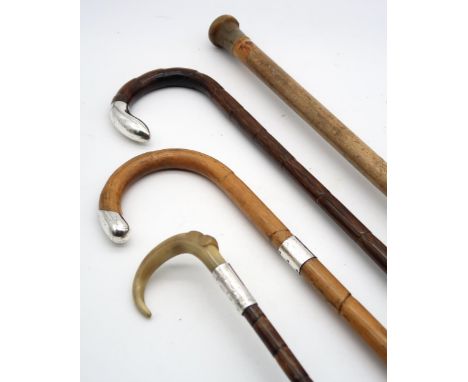 A Chester silver-mounted, horn-handled bamboo Paragon parasol; a Birmingham silver-mounted bamboo walking stick; another simi