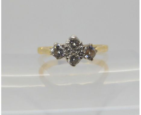 An 18ct gold four diamond cluster ring, set with estimated approx 0.25cts of brilliant cut diamonds, size M1/2, weight 3.7gms