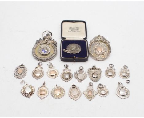 A collection of silver fob medals including a large silver and guilloche enamel example by&nbsp;William James Dingley, Birmin
