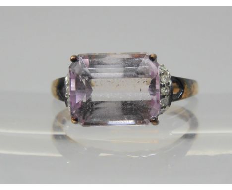 A 9ct rose gold kunzite and diamond ring, size P1/2, weight 3.4gms, with Rocks &amp; Co certificate Condition Report:Availabl