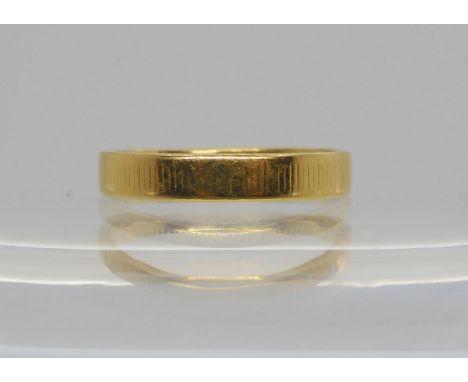 A bright yellow metal wedding ring, size Q, weight 4gms Condition Report:Available upon request