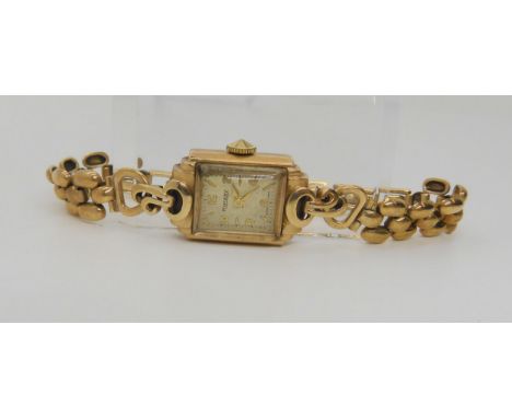 A 9ct gold ladies vintage Rotary watch and strap, (two loose links) weight together with the mechanism 20.8gms Condition Repo