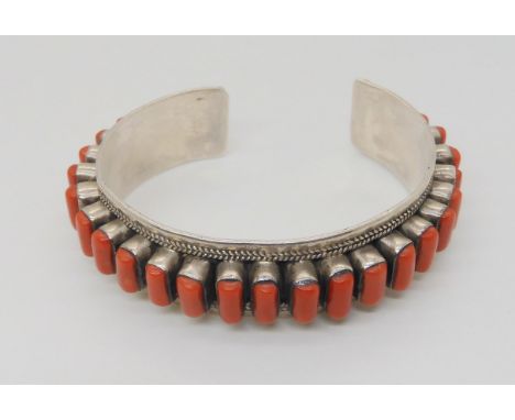 A silver coral set bangle Condition Report:Not available for this lot.