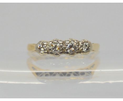 An 18ct gold four stone diamond ring, set with estimated approx 0.25cts of brilliant cut diamonds, size M1/2, weight 2.9gms C