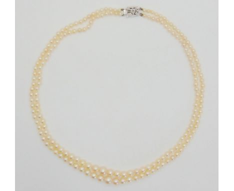 A double string of good quality pearls with a 9ct white gold diamond set clasp. Largest pearl approx 7.4mm, smallest 3.2mm, l
