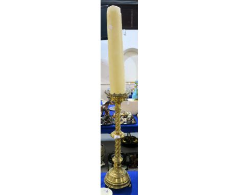 An ecclesiastical brass candlestick, 70cm high Condition Report:Available upon request