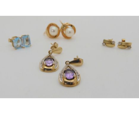 A pair of 14k gold pearl screw back earrings, weight 2.8gms, and three pairs of 9ct gem set earrings, weight 3.1gms Condition