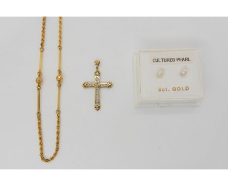 A 9ct gold diamond set cross, set with estimated approx 0.20cts of brilliant cut diamonds, a pair of pearl ear studs, weight 