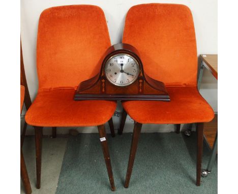 A pair of mid 20th century teak framed dining chairs with orange upholstery and a mahogany mantle clock (3) Condition Report: