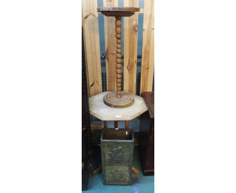 A 20th century pine octagonal topped occasional table, circular topped table with bobbin turned upright and a brass stick sta