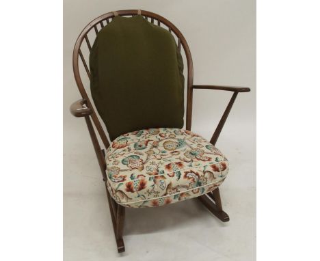 A mid 20th century elm and beech Ercol rail back rocking chair, 91cm high x 75cm wide x 80cm deep Condition Report:Available 