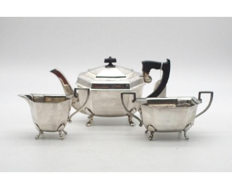 An Art Deco Bachelor's silver tea service, the bodies faceted, on four paw feet, by Emile Viner, Sheffield 1945, 927gms Condi