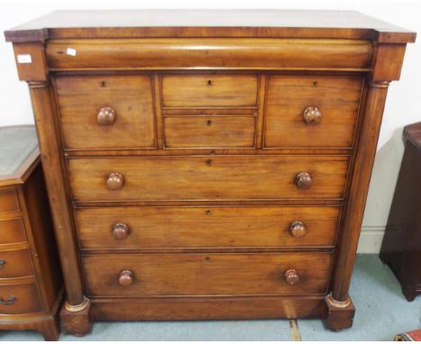 A Victorian mahogany Scotch chest with single frieze drawer over four short drawers over three long drawers all with glazed c