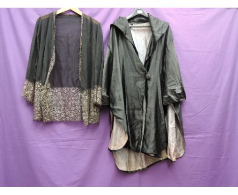 A coat or cover up in black satin lined in blue silk with singular button fastening and shawl collar and a crepe georgette an