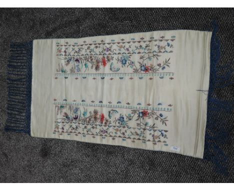 An early 20th century Chinese pocket sash having extensive colourful floral and butterfly embroidery throughout to cream silk