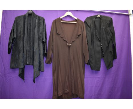 A 1930s Art Deco coat in brown crepe and two similar jackets/cover ups in black.