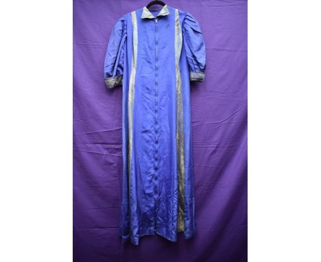 A 1930s purple taffetta house coat, having long zip to front(thought to be a later addition) and brocade like accents in a pa