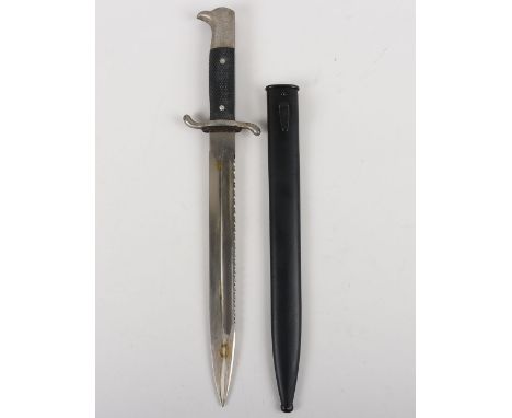 WW2 German Sawback Fire Police Bayonet by Alcoso, Solingen, with two piece chequered grips, steel pommel and ‘S’ type cross g