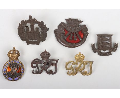 Grouping of British Officers Badges, including silver gilt and enamel Edward VII Royal Military College cap badge, Essex regi
