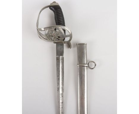 Imperial German Model 1889 Uhlan Sword, good example with basket hilt having Imperial eagle, plain pommel and black grip. The