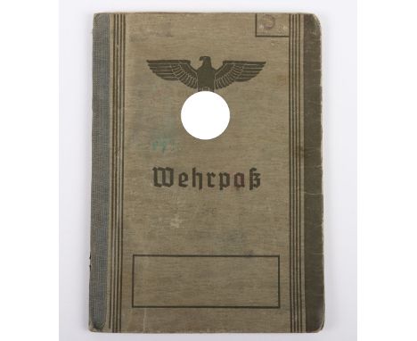 WW2 German Army Wehrpass to an NCO Gebirgsjäger R. Phin, Art. Regiment Nr 8, Heavily Wounded, Amputated Leg. Awarded with the