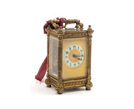 19TH CENTURY GILT BRASS CARRIAGE CLOCK, fancy case with Arabic enamel chapter ring, swing handle. platform escapement, bevell