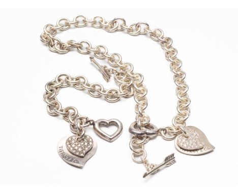 WHITE METAL OPEN HEART & ARROW NECKLACE together with matching bracelet, both with heart drops stamped 'Tiffany & Co' (2)Prov