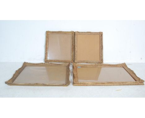 Two pairs of vintage 20th century antique style gilded picture frame. The Baroque style plaster and wood frames of a rectangu