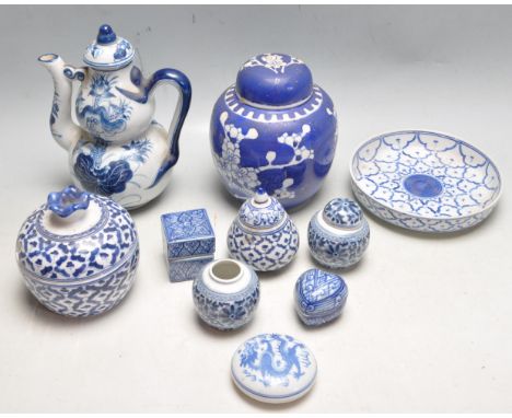 A collection of antique early 20th century blue and white china ware to include a ginger jar, water jug, trinket pot, plates 
