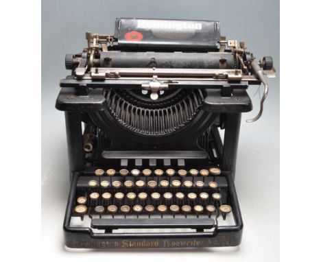 An early 20th century&nbsp;Remington Standard No. 10 typewriter, finished in black with gilded detailing and circular keys. 1