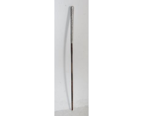 A large early 20th century silver swagger stick having a highly decorated handle with profuse floral detailing. Stick measure