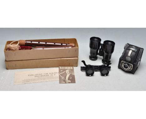 A collection of vintage 20th century curiosity items to include a West German zoom glasses, zones binoculars, Ensign Ful - Vu