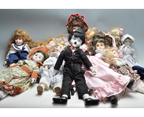 A large collection of vintage 20th century porcelain dolls with cloth body, ceramic limbs, painted features, realistic hair o