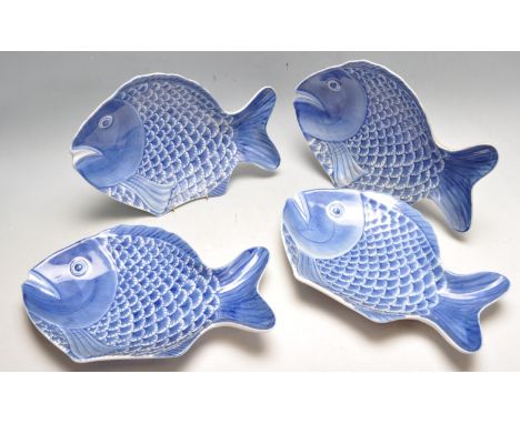 A set of four mid 20th century chinese Republic Period blue and white ceramic plates in the form of fish. Each having raised 