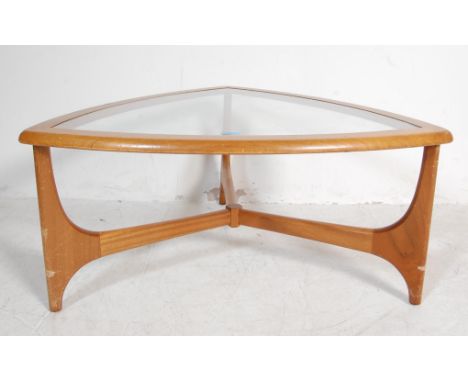 Stonehill- Stateroom- A retro mid 20th Century teak wood coffee table of triangle form having inset glass panel. Makers label