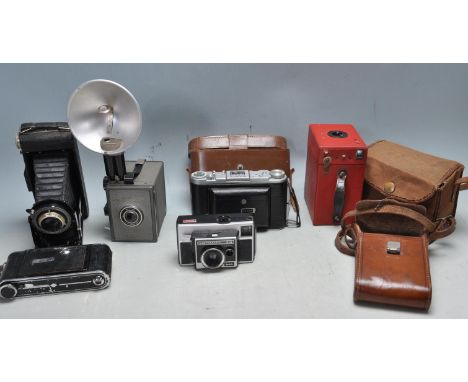 A collection of 20th century vintage cameras to include a Kodak Monitor, Spectator Clash, Instamatic 314, Kodak Jr Six-16 Ser