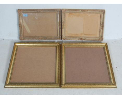 Two pairs of vintage 20th century antique style gilded picture frame. A pair of Baroque style plaster and wood rectangular fr