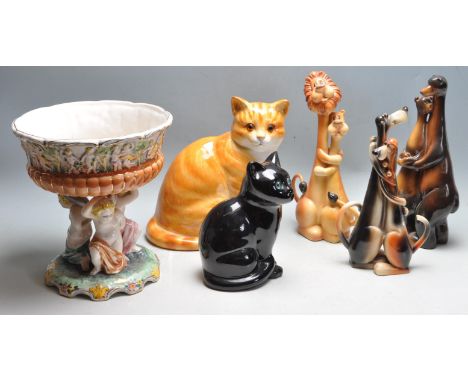 A good collection of vintage 20th century English and continental ceramic figurines to include a large ginger cat by Just Cat