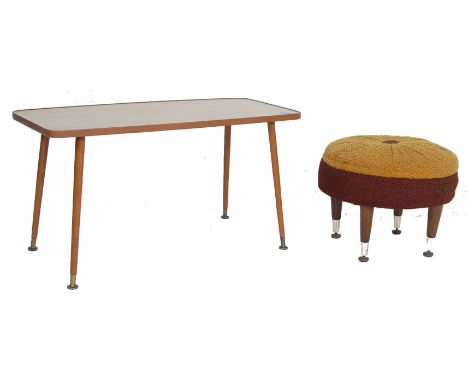 A retro vintage 1970s teak wood coffee table of rectangular form raised on tapering legs with brass cap feet together with a 