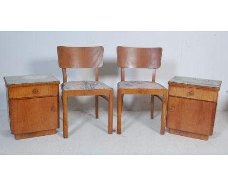 A pair of mid century bedside cabinets of pedestal form having single drawers over cupboard, raised on plinth base. Together 