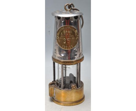 An early 20th century brass and metal miners lamp. Manufactured by The Protector Lamp &amp; lighting Co Ltd. Type GR6S RM &am