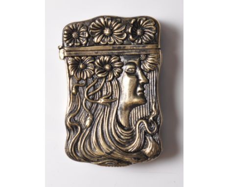 A vintage style Art Nouveau brass vesta case having floral decoration to the hinged lid atop a stylised female in profile. Ma