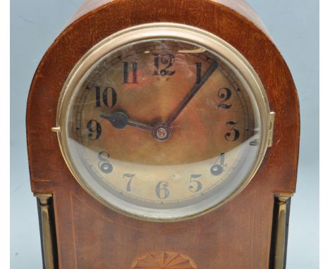 An early 20th century Edwardian antique inlaid mahogany 8 day mantel clock by WML Gilbert having a dome top, brass faced with