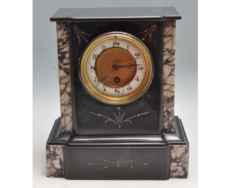A 19th century French marble mantel clock having glass cased ceramic dial with arabic numerals to the chapter ring with a&nbs