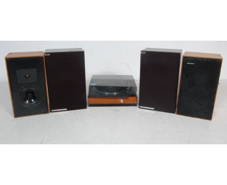 A vintage retro 20th century teak wood case Garrard record player with smoked plastic cover along with a pair of teak veneer 